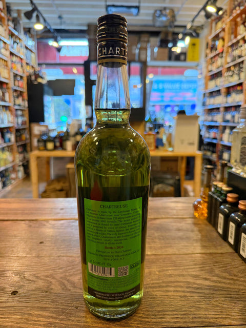 Tall clear bottle with black cap