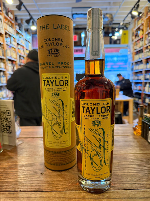 Tall clear bottle with yellow label