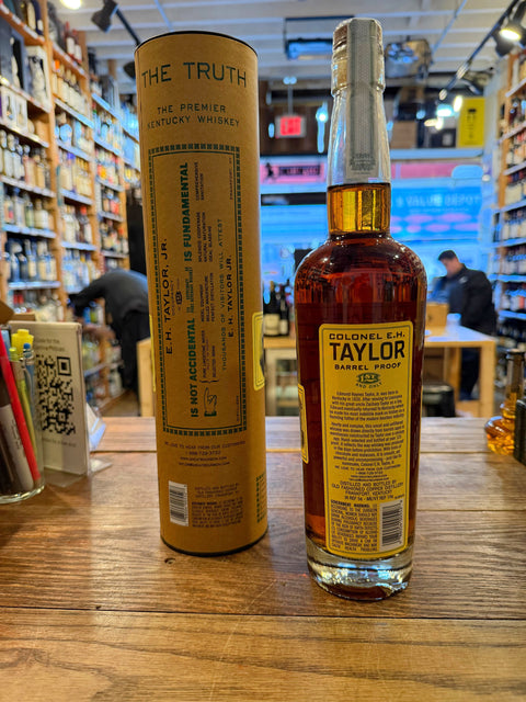 Tall clear bottle with yellow label