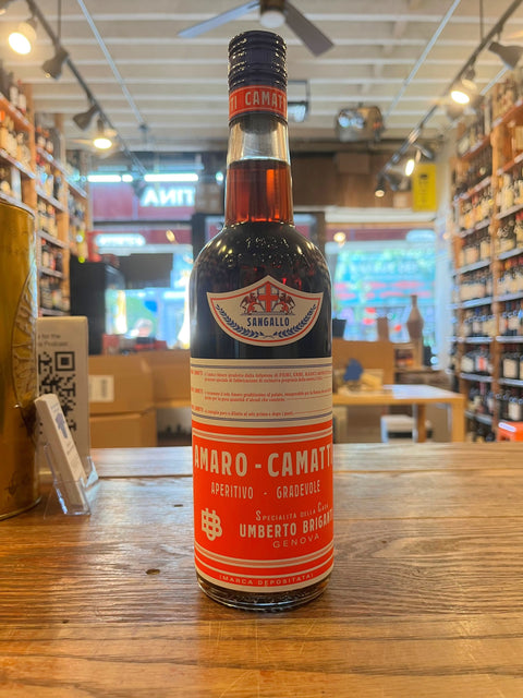 Amaro Camatti tall slender bottle with orange label with white text that says aperitivo gradevole