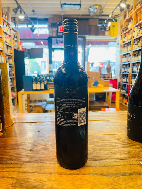 Man O' War Ironclad Bordeaux Blend 750mL a dark glass wine bottle with a black label and black top