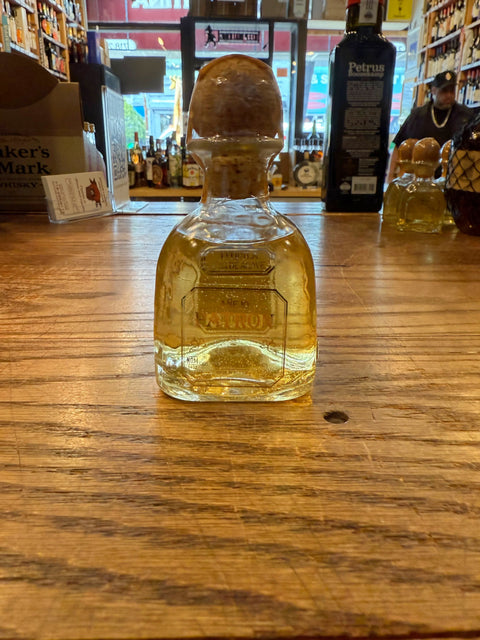 Patron Anejo 100mL clear bottle with cork on top.