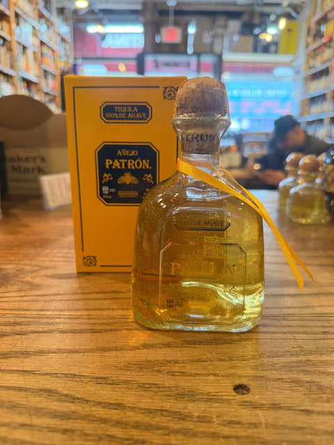 Patron Anejo 375mL clear bottle with cork top.