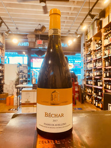 Caggiano Fiano di Avellino Bechar a bottom heavy dark wine bottle with a mustard yellow and white label. yellow top