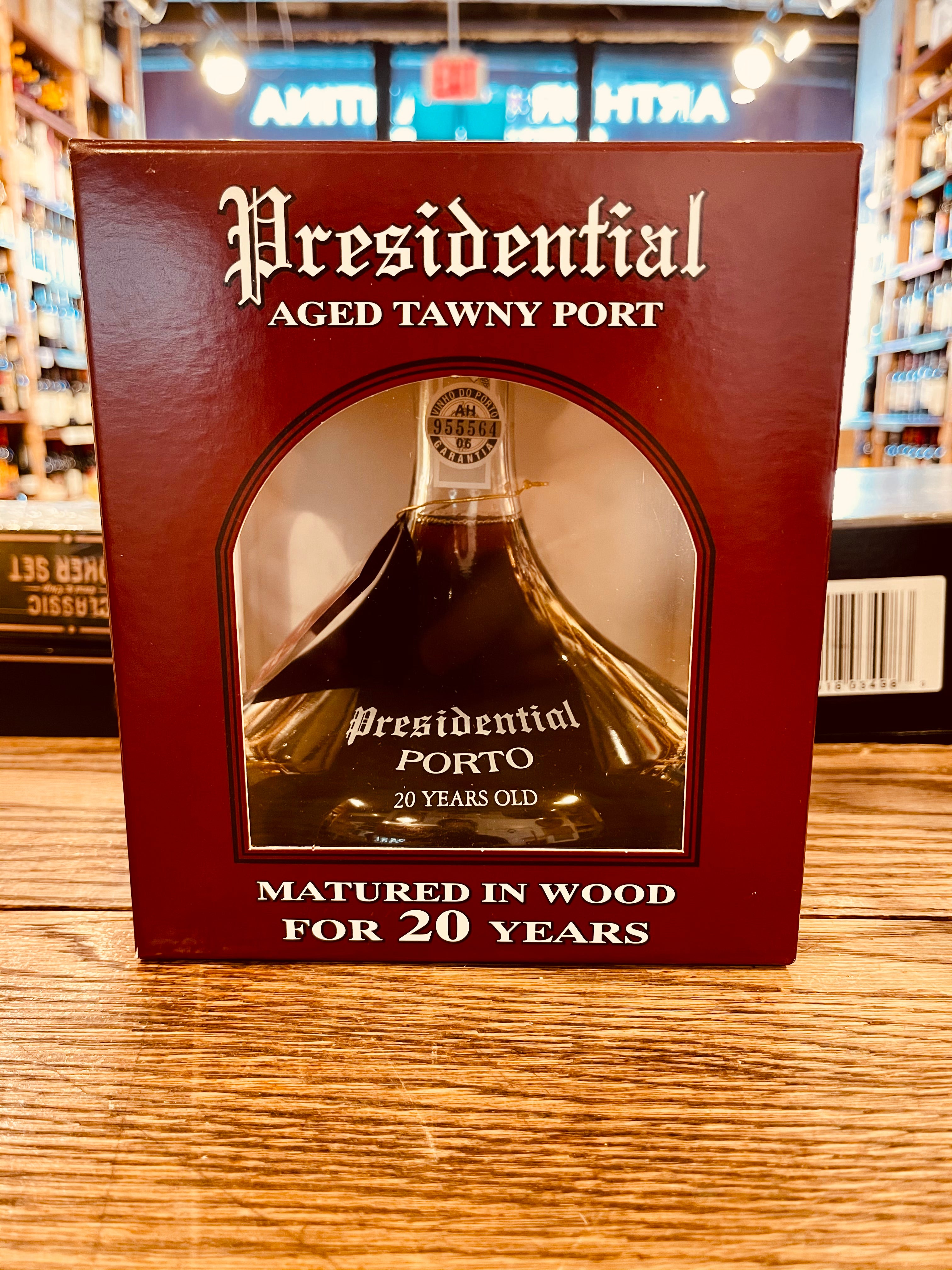 Presidential Porto Tawny 20yr 750ml Ship a decanter shaped glass bottle inside of a maroon square box with white lettering