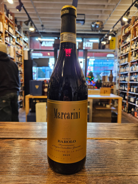 Marcarini Barolo 2019 750mL a dark glass wine bottle with a golden label and a black top