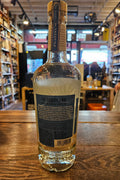 El Tequileno Platino Blanco 750mL a clear glass bottle with rounded shoulders and a beige label and wood top
