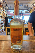Eltequileno Reposado Gran Reserva 750mL a clear round shouldered glass bottle with a beige label and a wooden top