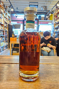 Baker's 7 Year Single Barrel High Rye Bourbon Limited Release 750mL a clear cylinder glass bottle with a black label and a metal top