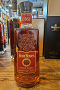 Four Roses OBSF Single Barrel 100 Proof Kentucky Straight Bourbon Whiskey 750mL a clear glass squared shouldered bottle with a red label and wooden top