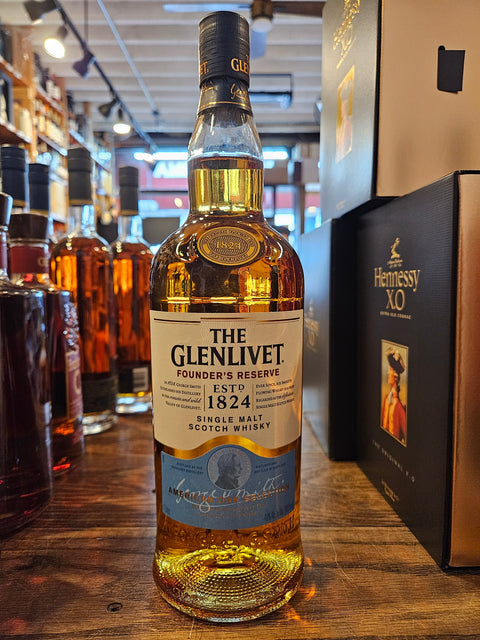 The Glenlivet Founder's Reserve Single Malt Scotch Whisky 1L a clear glass bottle with a white label and blue top