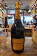Ruggeri Giall'oro Prosecco 750mL a dark glass champagne shaped bottle with a yellow label and yellow top