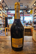 Ruggeri Giall'oro Prosecco 750mL a dark glass champagne shaped bottle with a yellow label and yellow top
