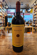 Masseto Toscana 2020 750mL a dark wine bottle with a beige label and red top