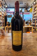 Masseto Toscana 2020 750mL a dark wine bottle with a beige label and red top