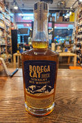 Bodega Cat Straight Rye Whiskey 750mL a round shouldered clear glass bottle with a blue label and wooden top