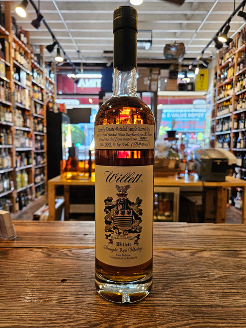 Whiskey bottle with a label on a wooden surface in a store setting