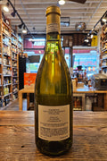Wine bottle with a blurred store interior in the background