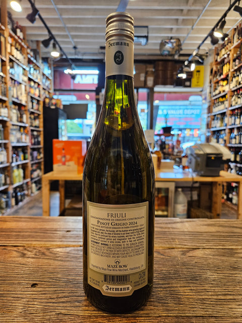 Wine bottle on a wooden surface with a store interior in the background