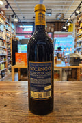 Wine bottle with label on a wooden surface in a store setting