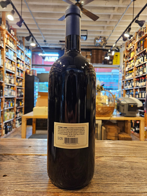 Bottle of wine with a label on a wooden surface in a store setting