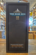 Whiskey box with 'The Boss Hog' branding on a wooden surface.