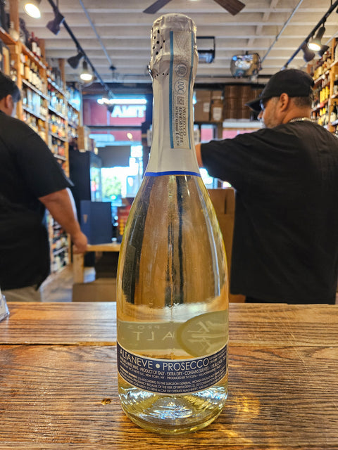 Bottle of Prosecco on a wooden surface with a blurred background