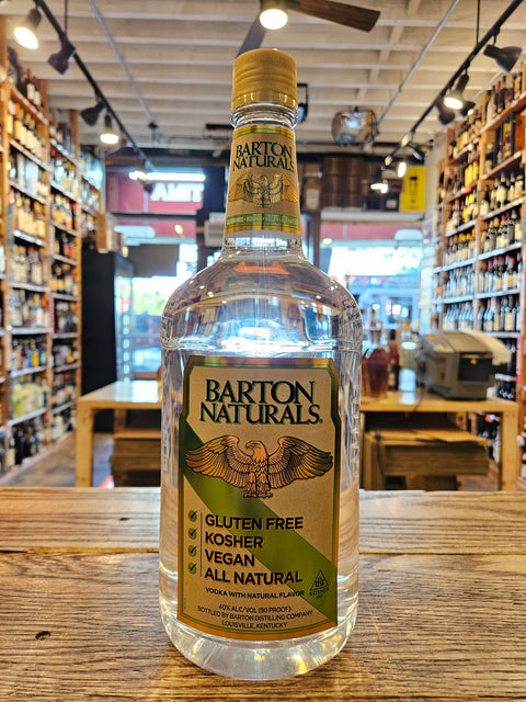 Bottle of Barton Naturals on a wooden surface with a store interior in the background