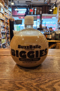 Buzzball Cocktails Biggie bottle on a wooden surface with a store interior in the background