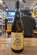 Wine bottle with label on a wooden surface in a store setting