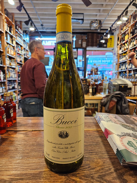 Wine bottle on a wooden surface with a blurred store interior in the background