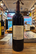 Wine bottle with label on a wooden surface in a store setting