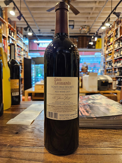 Wine bottle with label on a wooden surface in a store setting