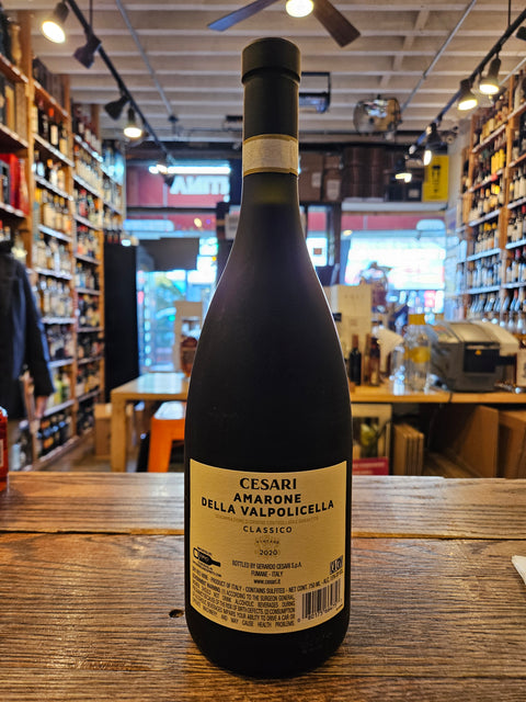 Wine bottle on a wooden surface with a store interior in the background