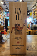 Wooden whiskey box with artistic design on a wooden surface