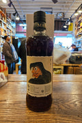 Japanese Whisky bottle with label on a wooden surface in a store setting