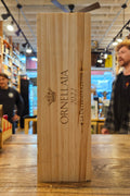 Wooden box with 'Ornetalia' branding in a store setting