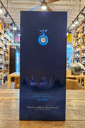 Blue wine box with a brand logo on a wooden surface
