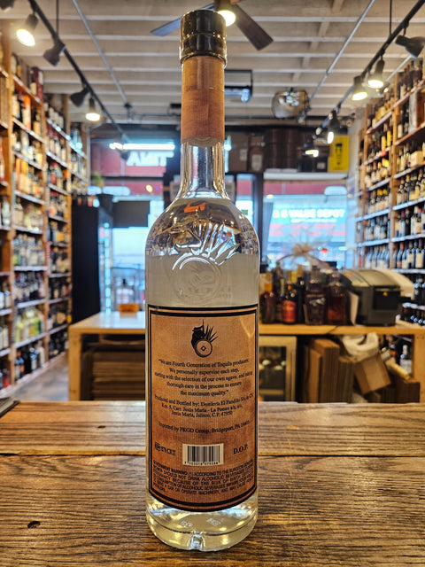 Wine bottle on a wooden surface with a blurred indoor background