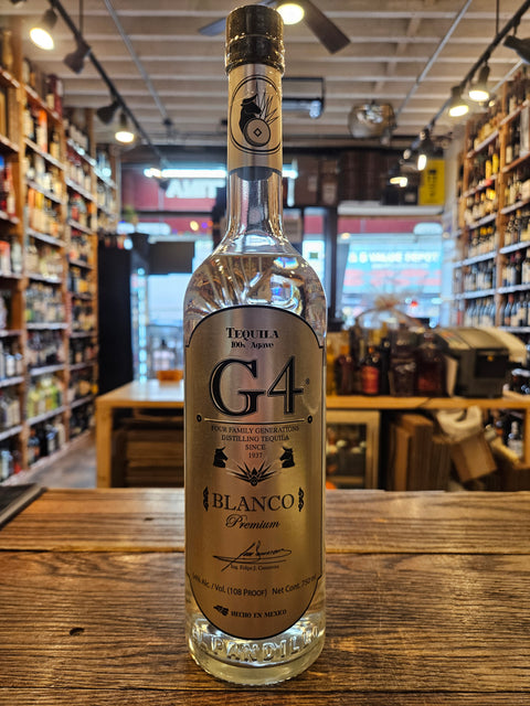Bottle of G4 Blanco tequila on a wooden surface with a blurred store interior in the background