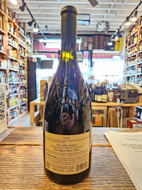 Wine bottle with label on a wooden surface in a store setting