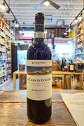 Wine bottle with label on a wooden surface in a store setting