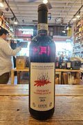 Bottle of wine on a wooden surface with a blurred indoor background