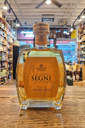A bottle of Segni Malpensa DOCG Solentino Bianco liquor, showing the golden-amber liquid and a tan label, set against a blurred background of a liquor store interior.