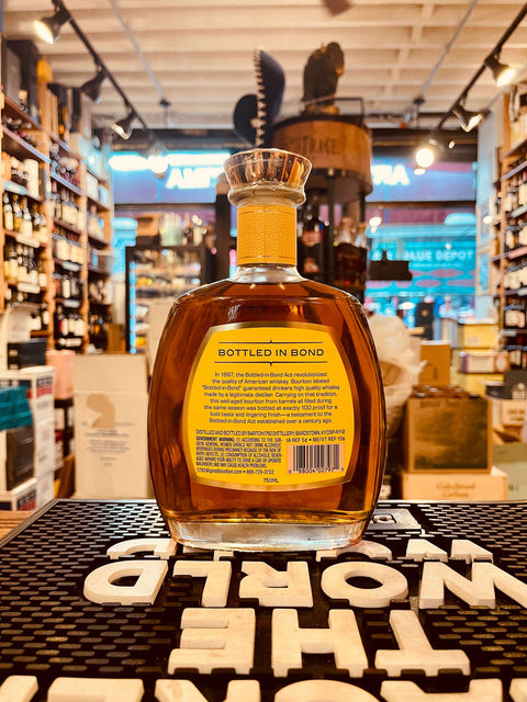 1792 Bottled In Bond 750mL short squat clear glass bottle with gold lettering and a gold top