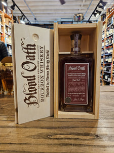 Blood Oath Bourbon Whiskey Pact No 9 750mL a wooden box with burnt in lettering and a squared clear bottle inside with red label