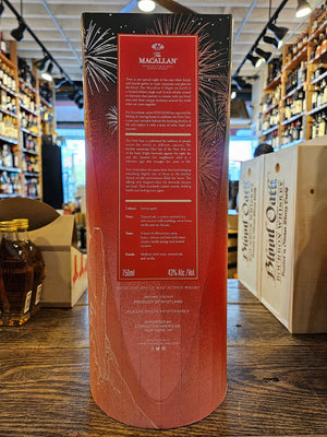 Macallan A Night on Earth - The Journey 750mL the backside of an orange box with a red label and white lettering