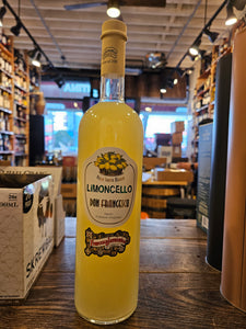 Jannamico Limoncello Don Francesco 1L a tall slender clear glass bottle with a white label and yellow liquid and beige top