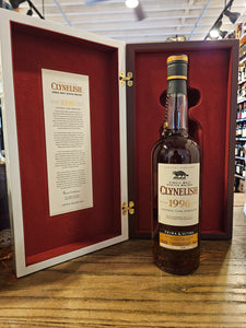 Clynelish 1996 Single Malt Scotch Whisky Prima and Ultima Fourth Release an open case box with red lining with a tall slender necked bottle in front of it with a white label
