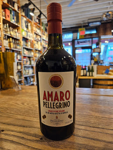 Amaro Pellegrino 750mL a squat dark robust bottle with a white label and red top